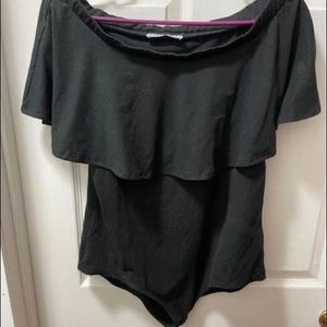 Black off the shoulder body suit.